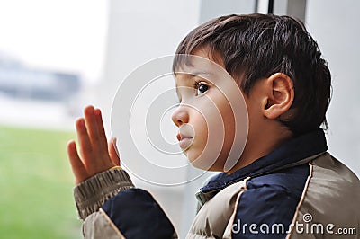 A kid on the window Stock Photo