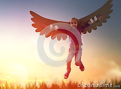 Kid with the wings of a bird Stock Photo