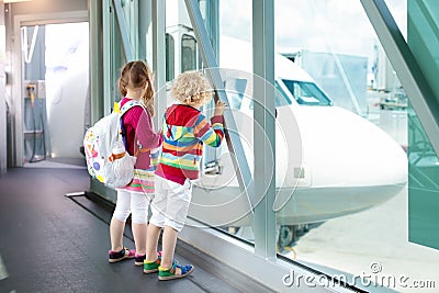 Kids travel and fly. Child at airplane in airport Stock Photo