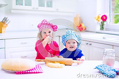 Kids baking in a white kitchen Stock Photo