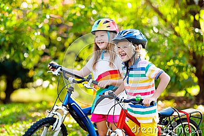 Kids on bike. Children on bicycle. Child biking Stock Photo