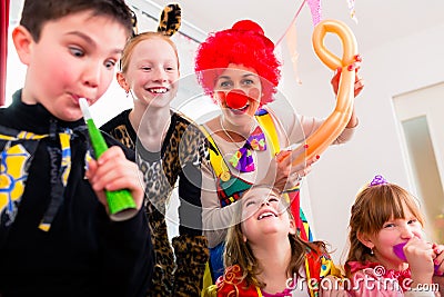 Kids birthday party with clown and lot of noise Stock Photo