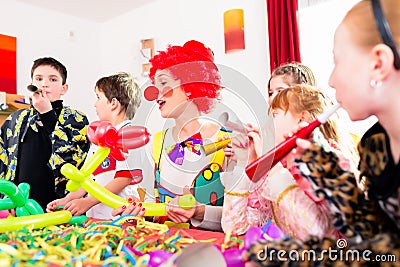 Kids birthday party with clown and lot of noise Stock Photo