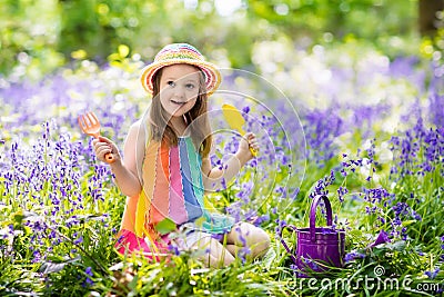 Kids in bluebell garden Stock Photo