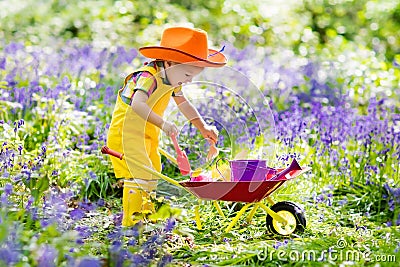 Kids in bluebell garden Stock Photo