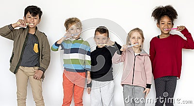 Kids brushing their teeth isolated on white background Stock Photo