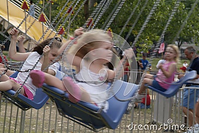 kids on carnival rides Editorial Stock Photo