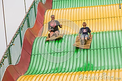 Kids on carnival slide at state fair Editorial Stock Photo