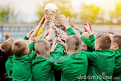 Kids Celebrating Soccer Victory. Young Football Players Holding Trophy Editorial Stock Photo