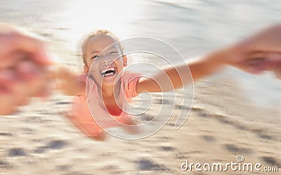 Kids, children and girl swinging on the beach while playing, laughing or having fun with a parent against the sand with Stock Photo
