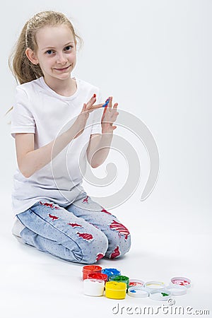 Kids Concepts. Portrait of Funny Young Girl With Brightly Painted Hands Stock Photo