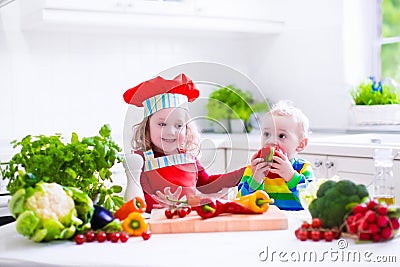 Kids cooking healthy vegetarian lunch Stock Photo