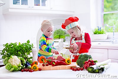 Kids cooking healthy vegetarian lunch Stock Photo