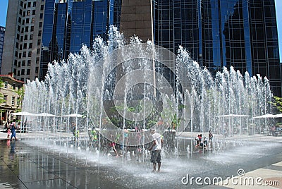 Kids cool off in fountain Editorial Stock Photo