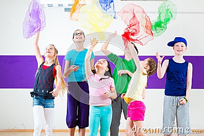 Kids in dancing class traninng with scarfs Stock Photo