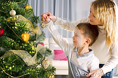 Kids decorating a Christmas tree Stock Photo