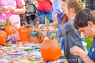 Kids Decorating Pumpkins at Festival Editorial Stock Photo