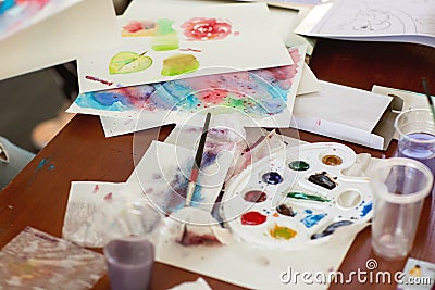 Kids draw with parents paint beautiful pictures, children`s creativity Stock Photo