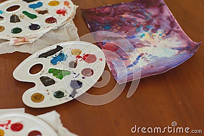 Kids draw with parents paint beautiful pictures, children`s creativity Stock Photo