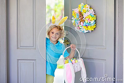 Kids Easter egg hunt. Child and eggs, bunny ears Stock Photo