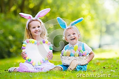 Kids on Easter egg hunt Stock Photo