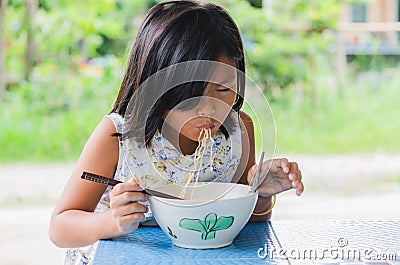 Kids eat noodles happily Stock Photo