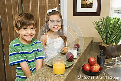 Kids eating breakfast. Stock Photo