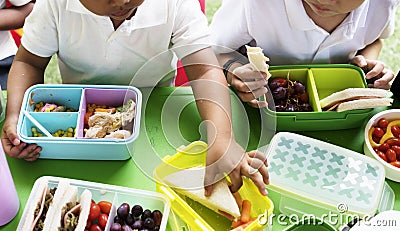 Kids eating lunch at elementary school Stock Photo