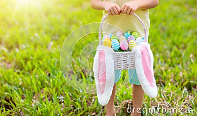 Kids with eggs basket on Easter egg hunt Stock Photo