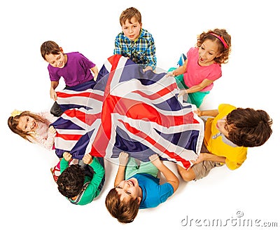 Kids with English flag in a middle of their circle Stock Photo