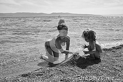 Kids enyoj happy day. mother and son on beach Stock Photo