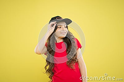 Kids fashion. Girl cute child wear cap or snapback hat. Little girl wearing baseball cap. Comfy and cool. Girl long Stock Photo