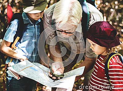 Kids following the directions of a compass Stock Photo