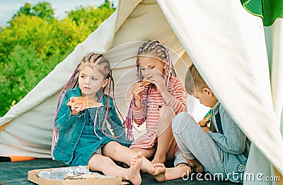 Kids friends eating tasty pizza. Children favorite food. Fastfood for kids. Child eating pizza. Italian junkfood. Stock Photo