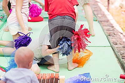 Kids games with cheerleading pom-poms Stock Photo