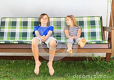 Kids On A Garden Swing Stock Photo - Image: 44698009