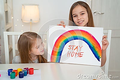 Kids girls write stay home. flashmob. rainbow Stock Photo