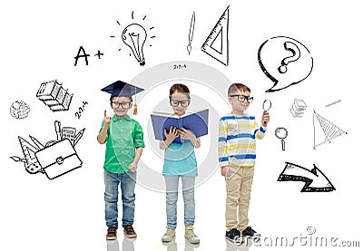 Kids in glasses with book, lens and bachelor hat Stock Photo