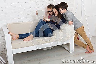 Kids in glasses with tablet, computer addiction Stock Photo