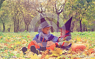 Kids in halloween costume play at autumn nature Stock Photo