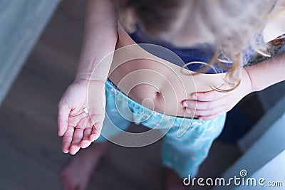 Kids Hand with one milk tooth. First tooth lost. Stock Photo