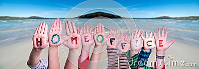 Kids Hands Holding Word Homeoffice Means Work From Home, Ocean Background Stock Photo