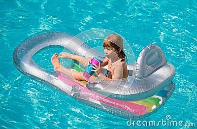 Kids happy summer. Summertime vacation. Child in pool. Boy swimming at swimmingpool. Funny kid on inflatable rubber Stock Photo