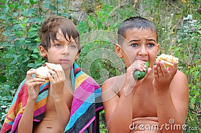 Kids having dinner outdoor Stock Photo