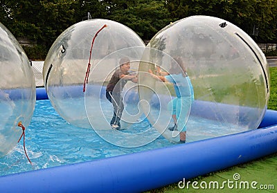 Kids having fun in air bubbles Stock Photo