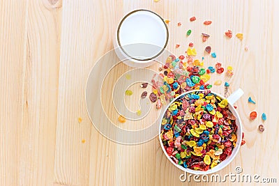 Kids healthy quick breakfast. Colorful rice cereal with milk on Stock Photo