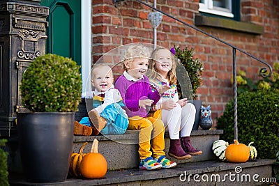 Kids at house porch on autumn day Stock Photo