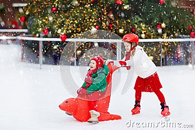 Kids ice skating in winter. Ice skates for child. Stock Photo