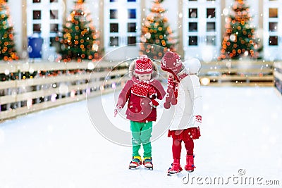 Kids ice skating in winter. Ice skates for child. Stock Photo