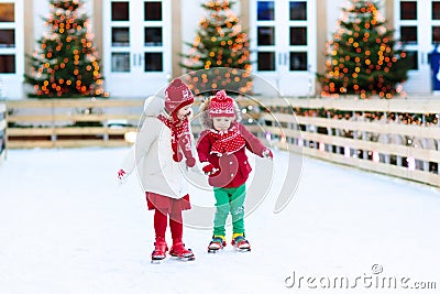 Kids ice skating in winter. Ice skates for child. Stock Photo